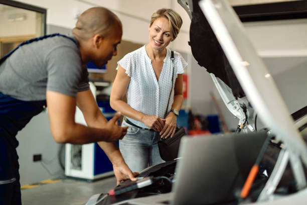 Technician discussing diagnostics with a customer